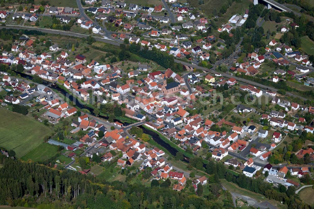 Aerial image Obersinn - Village view on the edge of agricultural fields and land in Obersinn in the state Bavaria, Germany