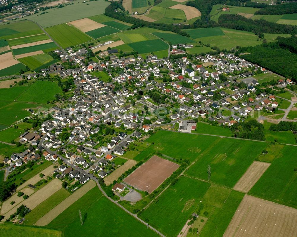 Aerial image Oberzeuzheim - Village view on the edge of agricultural fields and land in Oberzeuzheim in the state Hesse, Germany