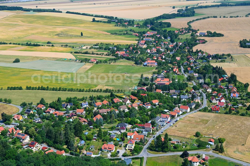 Pohrsdorf from the bird's eye view: Village view on the edge of agricultural fields and land in Pohrsdorf in the state Saxony, Germany