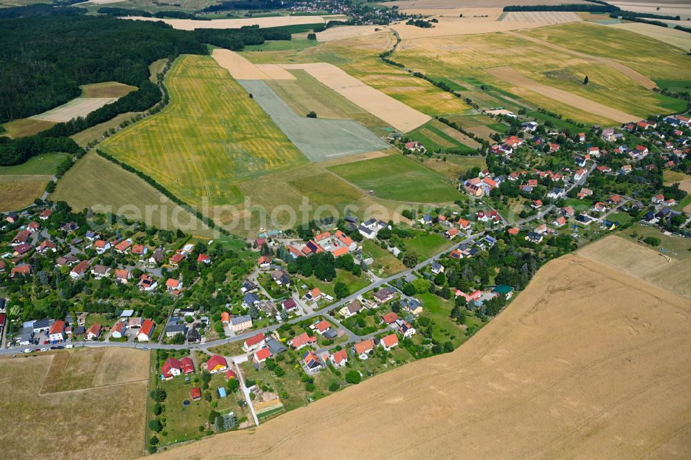 Pohrsdorf from the bird's eye view: Village view on the edge of agricultural fields and land in Pohrsdorf in the state Saxony, Germany