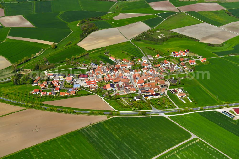 Possenheim from above - Village view on the edge of agricultural fields and land in Possenheim in the state Bavaria, Germany