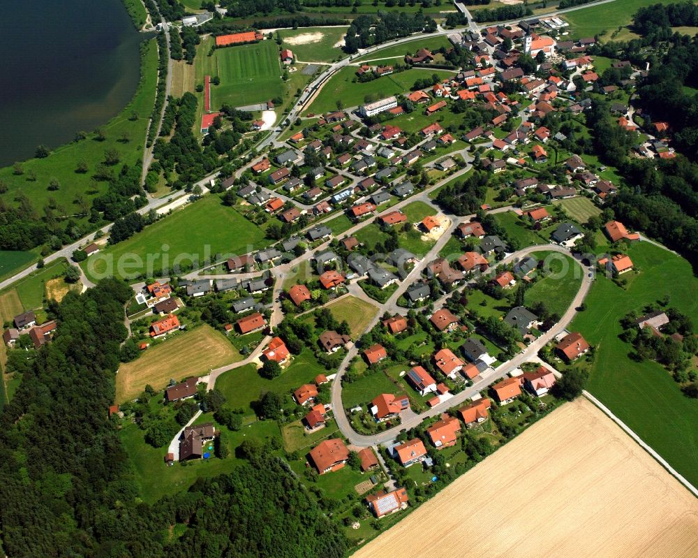 Postmünster from the bird's eye view: Village view on the edge of agricultural fields and land in Postmünster in the state Bavaria, Germany