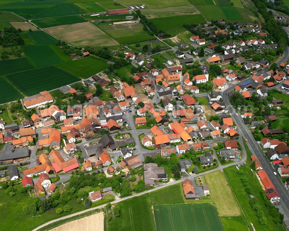 Aerial image Queck - Village view on the edge of agricultural fields and land in Queck in the state Hesse, Germany