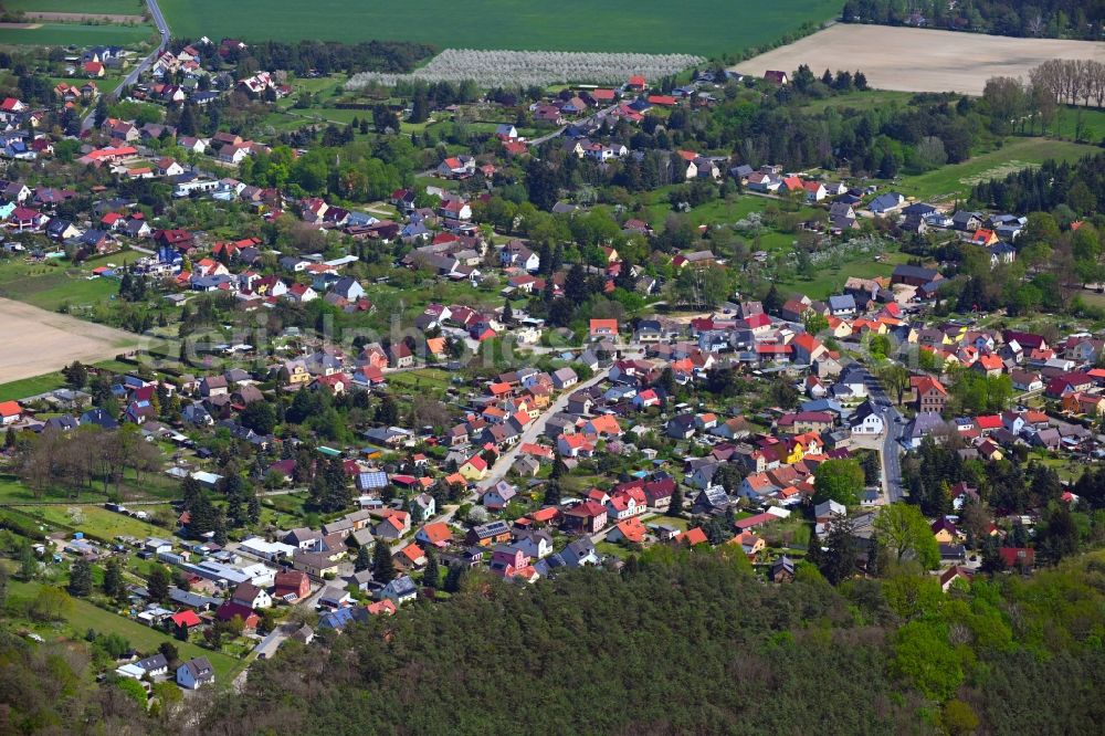 Rauen from above - Village view on the edge of agricultural fields and land in Rauen in the state Brandenburg, Germany