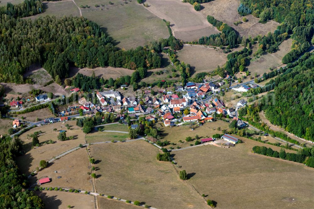 Aerial image Rengersbrunn - Village view on the edge of agricultural fields and land in Rengersbrunn in the state Bavaria, Germany