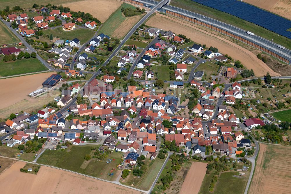 Aerial photograph Rettersheim - Village view on the edge of agricultural fields and land in Rettersheim in the state Bavaria, Germany