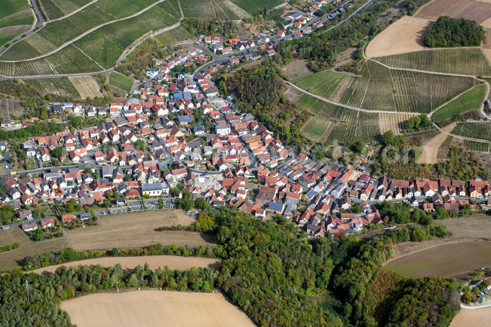 Aerial image Retzstadt - Village view on the edge of agricultural fields and land in Retzstadt in the state Bavaria, Germany