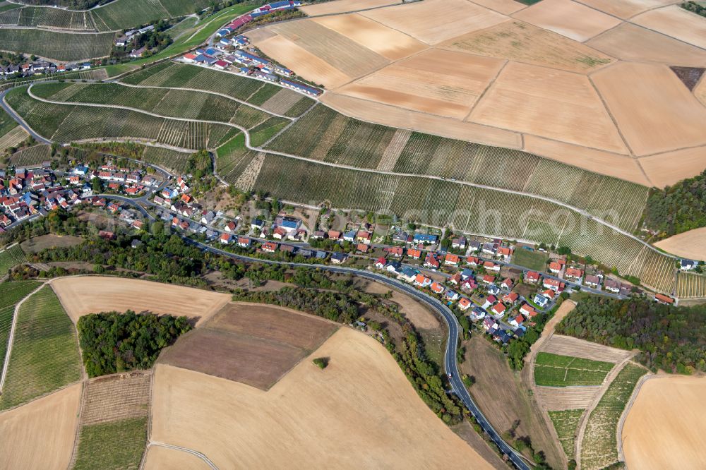 Retzstadt from above - Village view on the edge of agricultural fields and land in Retzstadt in the state Bavaria, Germany