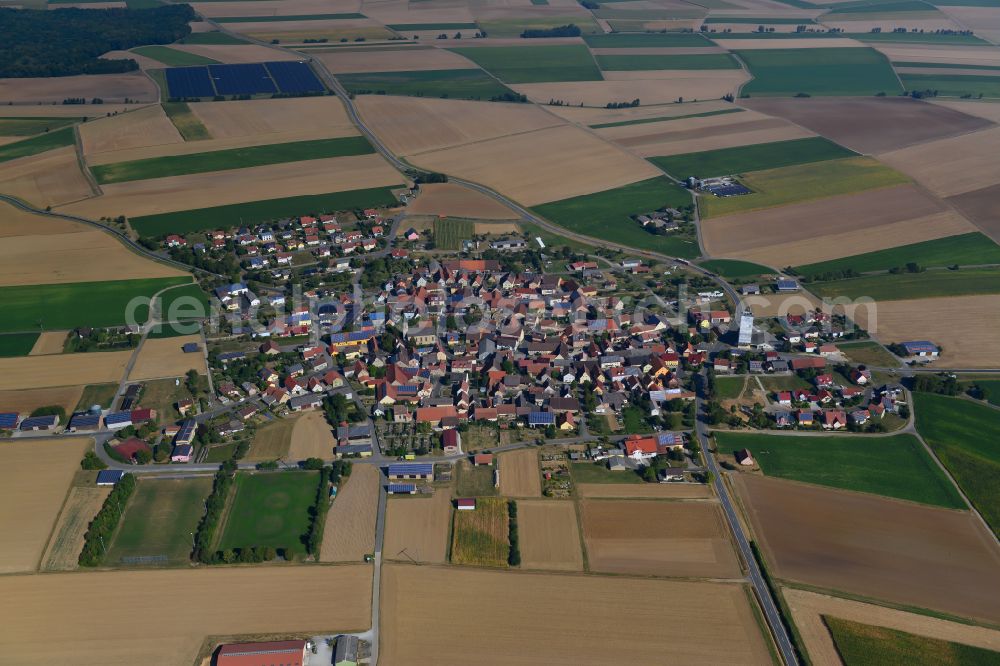 Riedenheim from the bird's eye view: Village view on the edge of agricultural fields and land in Riedenheim in the state Bavaria, Germany