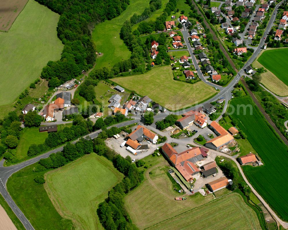 Aerial photograph Rimlos - Village view on the edge of agricultural fields and land in Rimlos in the state Hesse, Germany