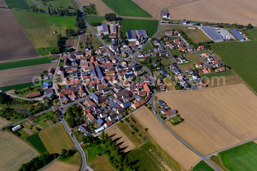 Aerial image Rittershausen - Village view on the edge of agricultural fields and land in Rittershausen in the state Bavaria, Germany