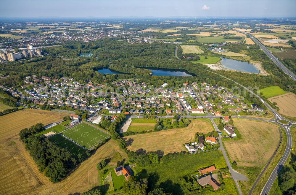 Roland from the bird's eye view: Village view on the edge of agricultural fields and land in Roland in the state North Rhine-Westphalia, Germany