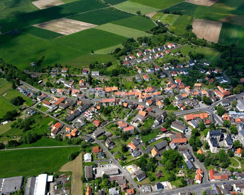 Romrod from above - Village view on the edge of agricultural fields and land in Romrod in the state Hesse, Germany