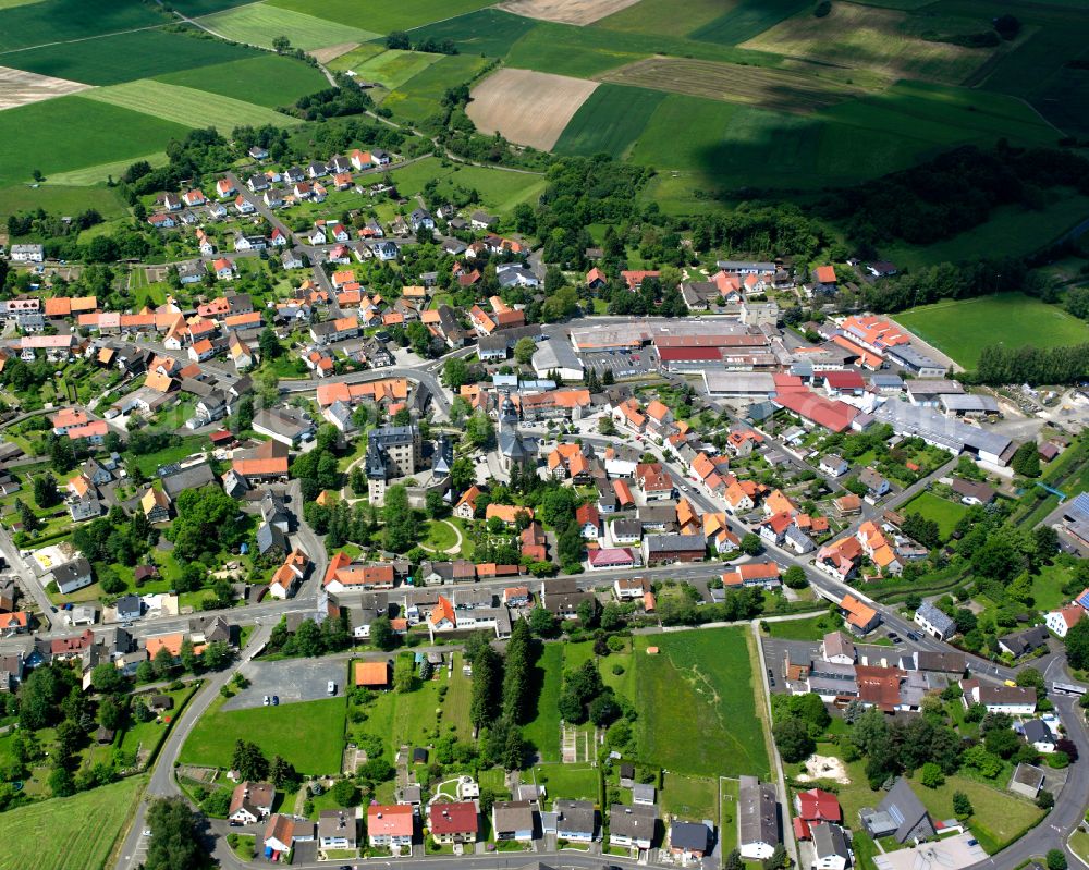 Aerial image Romrod - Village view on the edge of agricultural fields and land in Romrod in the state Hesse, Germany