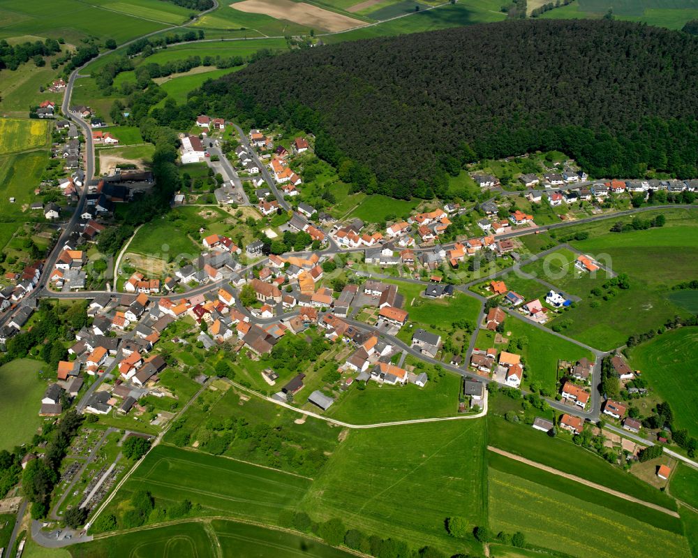 Ruhlkirchen from the bird's eye view: Village view on the edge of agricultural fields and land in Ruhlkirchen in the state Hesse, Germany