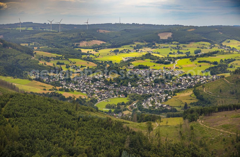 Saßmannshausen from above - Village view on the edge of agricultural fields and land in Saßmannshausen at Siegerland in the state North Rhine-Westphalia, Germany