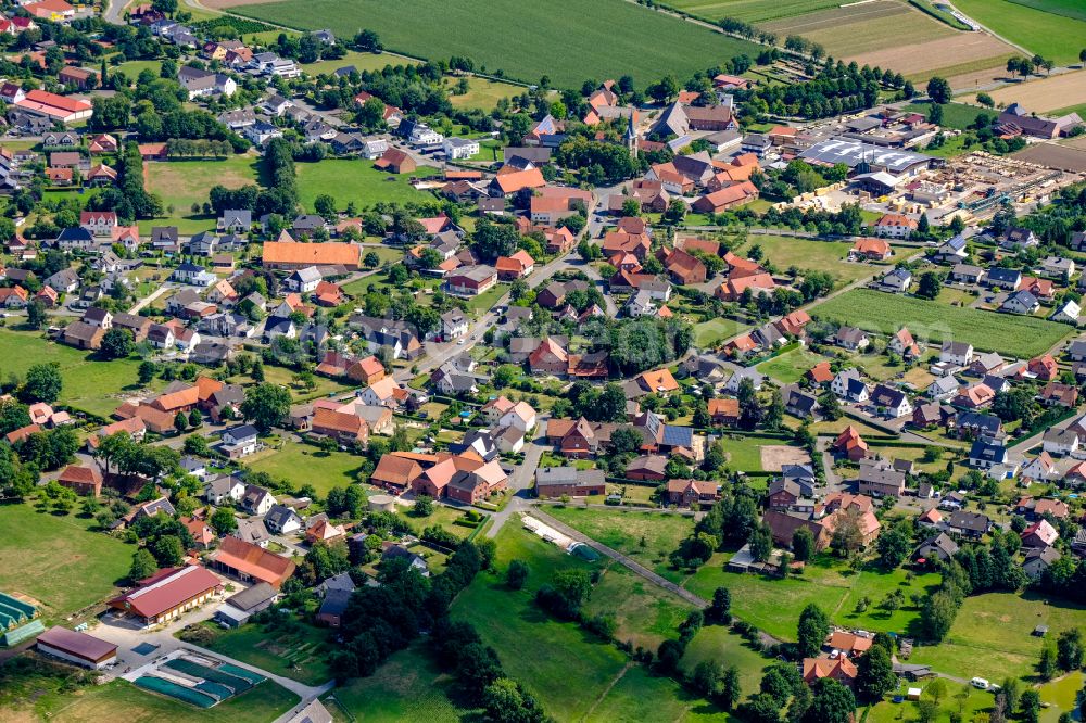 Scharmede from the bird's eye view: Village view on the edge of agricultural fields and land in Scharmede in the state North Rhine-Westphalia, Germany