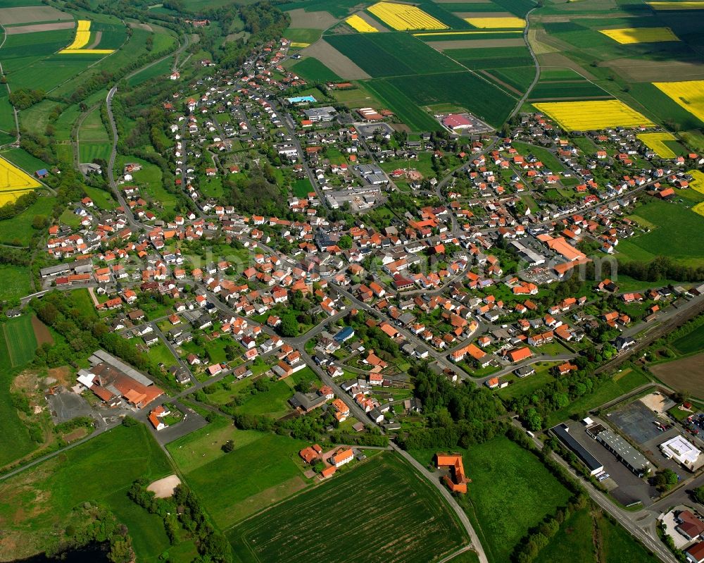 Schenklengsfeld from above - Village view on the edge of agricultural fields and land in Schenklengsfeld in the state Hesse, Germany