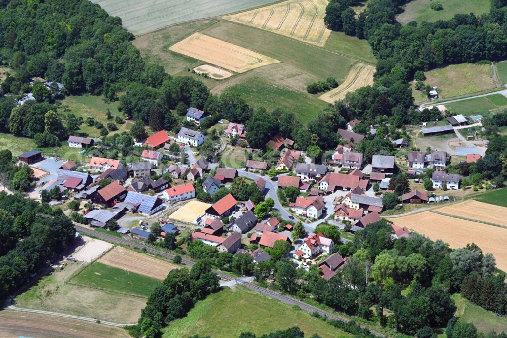 Schlömen from above - Village view on the edge of agricultural fields and land in Schloemen in the state Bavaria, Germany