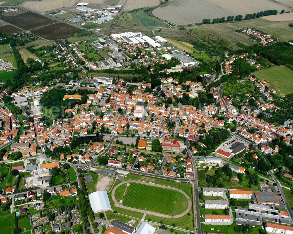 Schlotheim from the bird's eye view: Village view on the edge of agricultural fields and land in Schlotheim in the state Thuringia, Germany