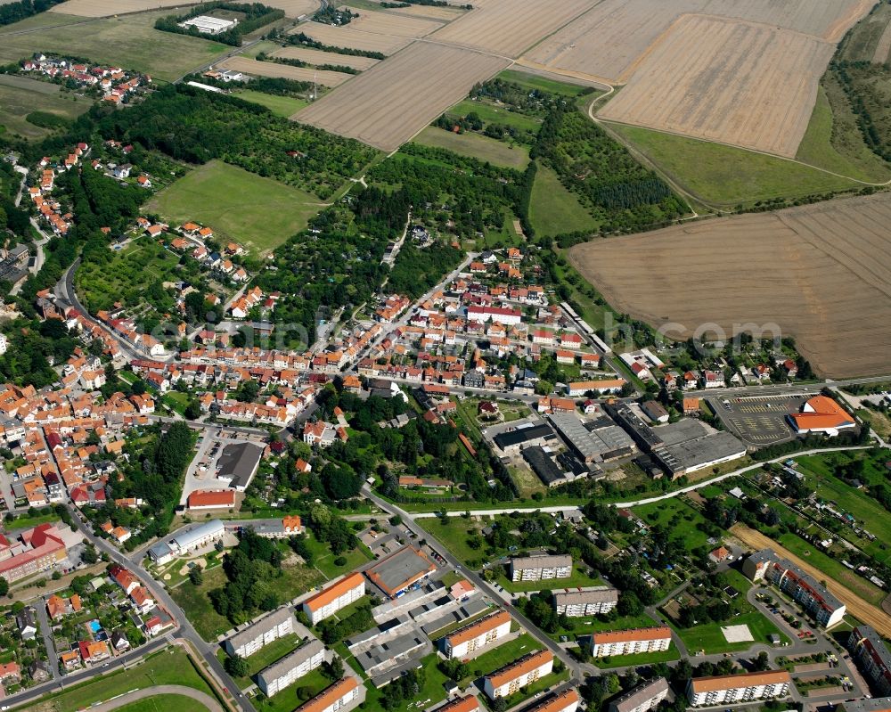 Schlotheim from above - Village view on the edge of agricultural fields and land in Schlotheim in the state Thuringia, Germany