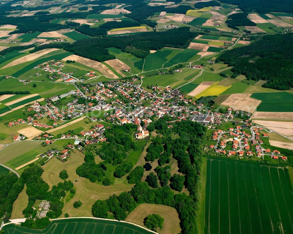 Schönau from the bird's eye view: Village view on the edge of agricultural fields and land in Schönau in the state Bavaria, Germany