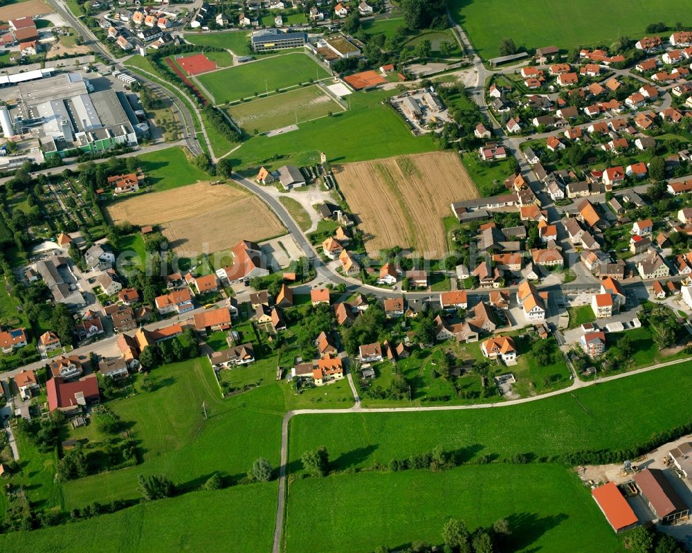 Aerial image Schnelldorf - Village view on the edge of agricultural fields and land in Schnelldorf in the state Bavaria, Germany