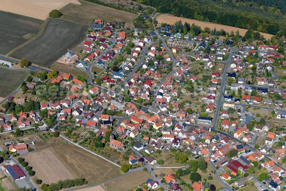 Schollbrunn from above - Village view on the edge of agricultural fields and land in Schollbrunn in the state Bavaria, Germany