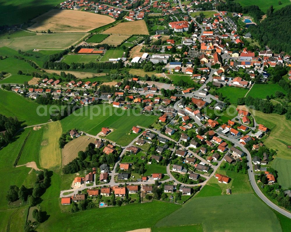 Schwarzach from the bird's eye view: Village view on the edge of agricultural fields and land in Schwarzach in the state Bavaria, Germany