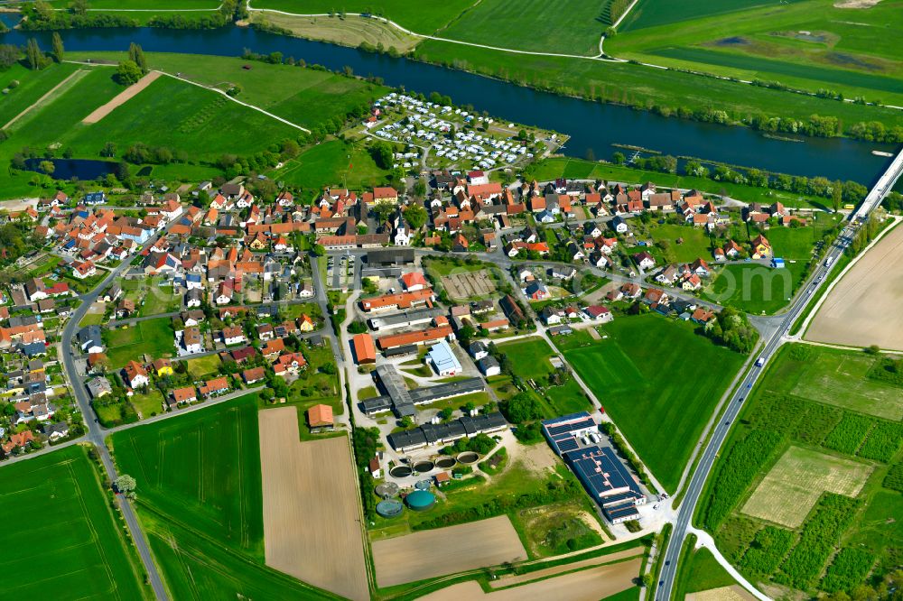 Schwarzenau from the bird's eye view: Village view on the edge of agricultural fields and land in Schwarzenau in the state Bavaria, Germany