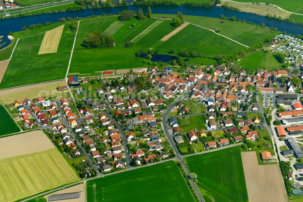 Aerial image Schwarzenau - Village view on the edge of agricultural fields and land in Schwarzenau in the state Bavaria, Germany