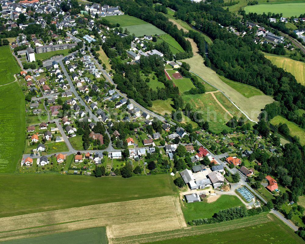 Aerial image Schwarzenbach an der Saale - Village view on the edge of agricultural fields and land in Schwarzenbach an der Saale in the state Bavaria, Germany