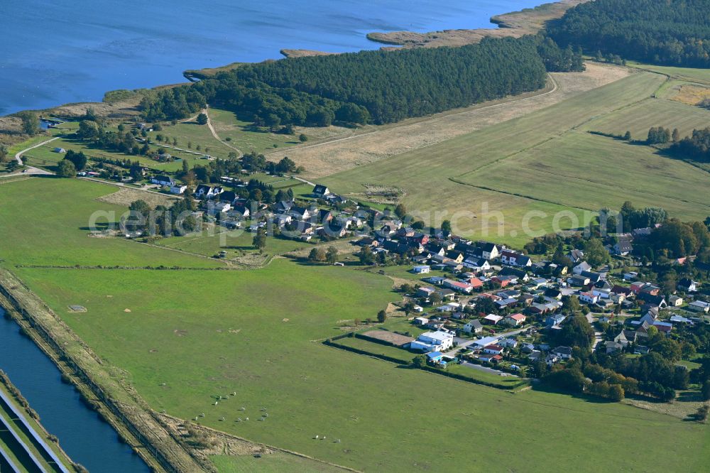 Kröslin from the bird's eye view: Town view on the edge of agricultural fields and farmland of Spandowerhagen on the Baltic Sea coast in the state Mecklenburg - Western Pomerania, Germany