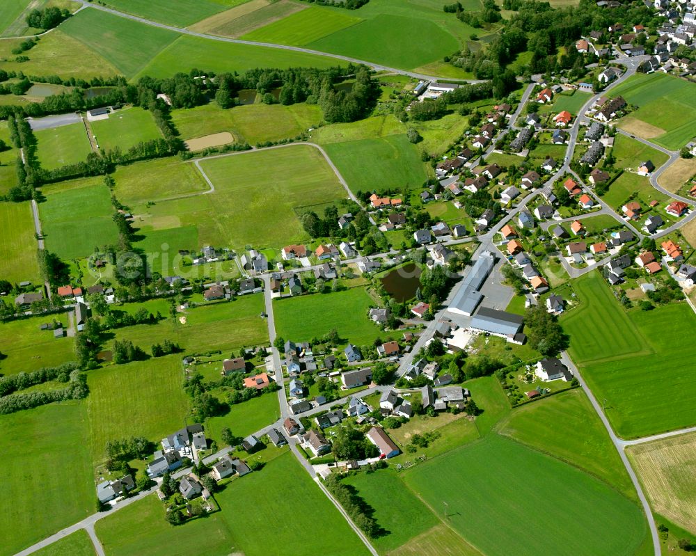 Sparneck from above - Village view on the edge of agricultural fields and land in Sparneck in the state Bavaria, Germany