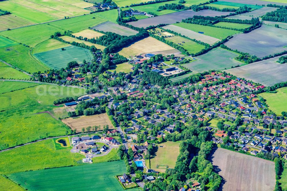 Stadum from above - Village view on the edge of agricultural fields and land in Stadum in the state Schleswig-Holstein, Germany