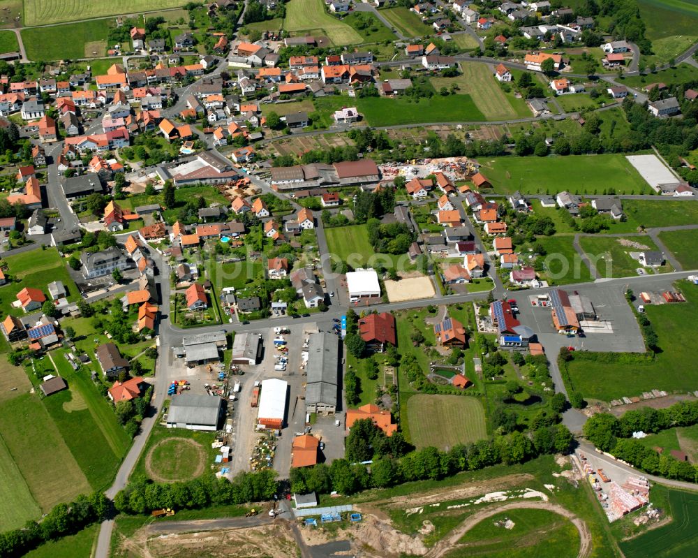 Aerial photograph Storndorf - Village view on the edge of agricultural fields and land in Storndorf in the state Hesse, Germany