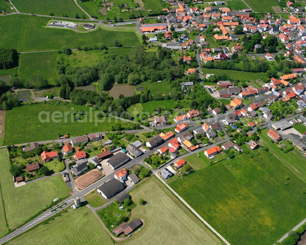 Storndorf from above - Village view on the edge of agricultural fields and land in Storndorf in the state Hesse, Germany