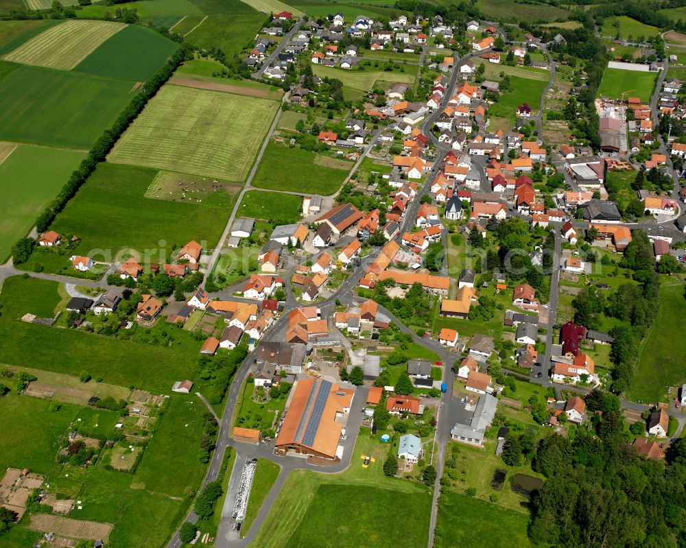 Aerial image Storndorf - Village view on the edge of agricultural fields and land in Storndorf in the state Hesse, Germany