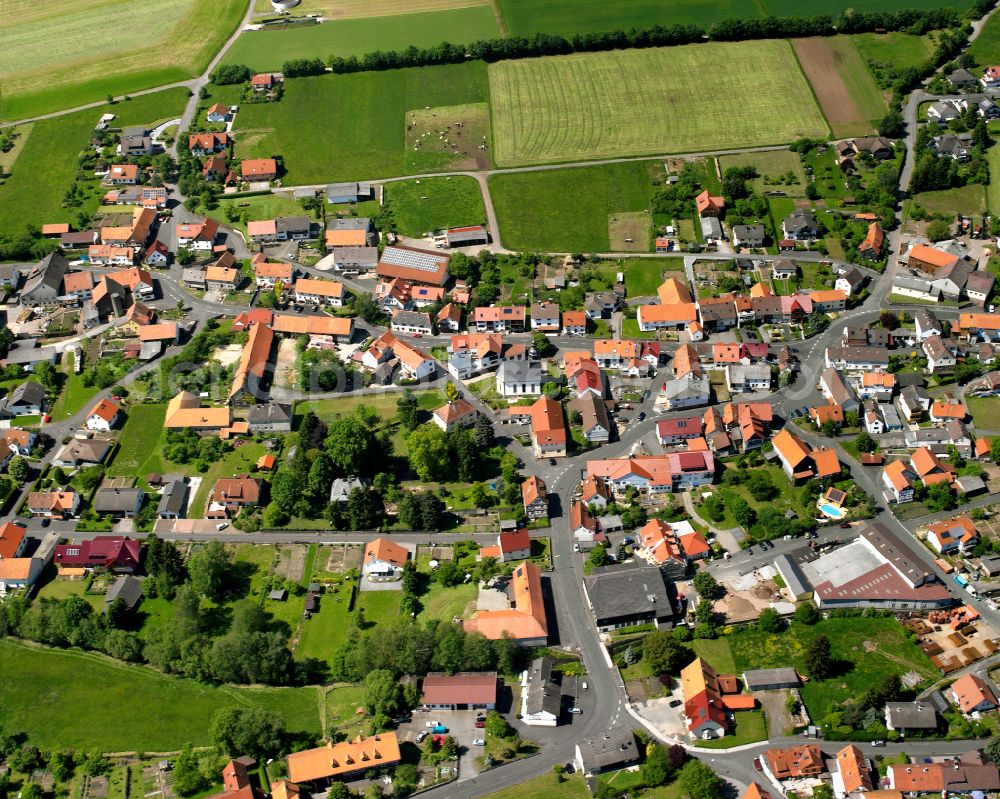 Aerial photograph Storndorf - Village view on the edge of agricultural fields and land in Storndorf in the state Hesse, Germany