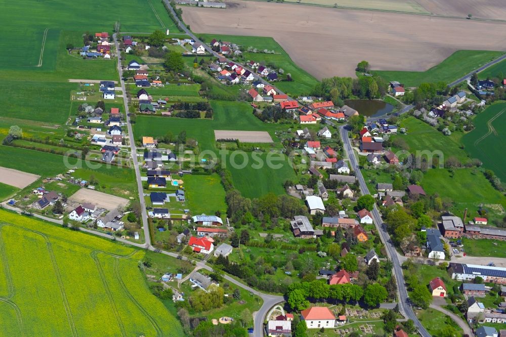 Aerial image Tauche - Village view on the edge of agricultural fields and land in Tauche in the state Brandenburg, Germany