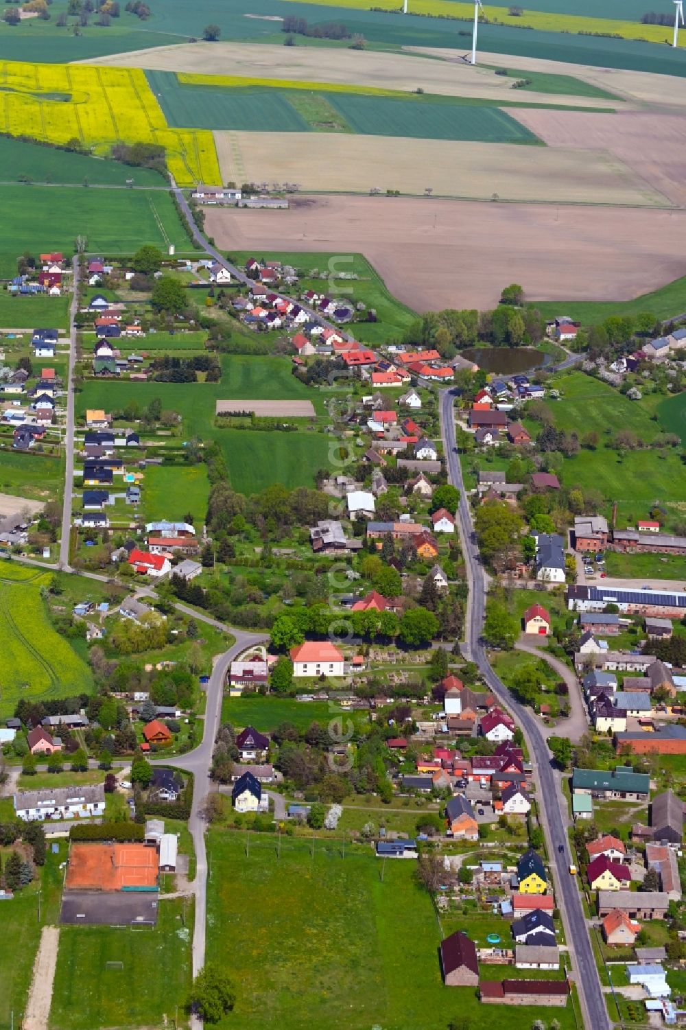 Aerial photograph Tauche - Village view on the edge of agricultural fields and land in Tauche in the state Brandenburg, Germany