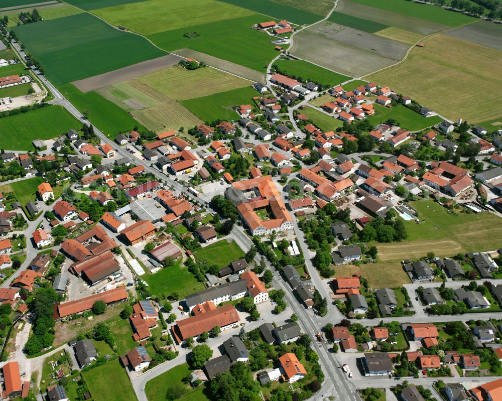 Teising from above - Village view on the edge of agricultural fields and land in Teising in the state Bavaria, Germany