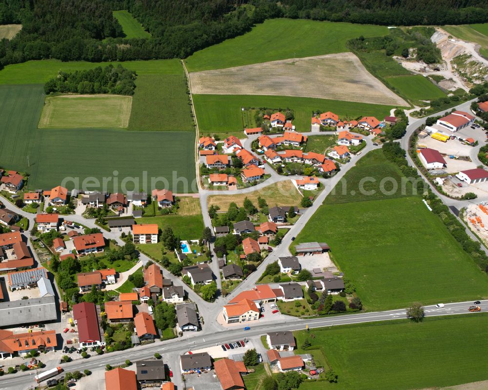 Teising from the bird's eye view: Village view on the edge of agricultural fields and land in Teising in the state Bavaria, Germany