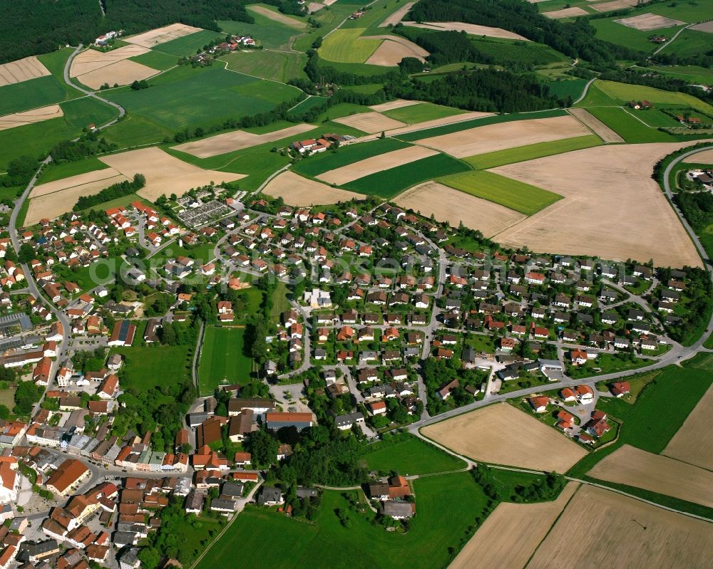 Triftern from the bird's eye view: Village view on the edge of agricultural fields and land in Triftern in the state Bavaria, Germany