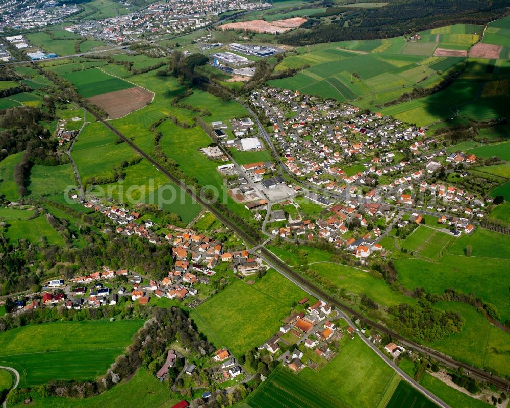 Unterhaun from the bird's eye view: Village view on the edge of agricultural fields and land in Unterhaun in the state Hesse, Germany