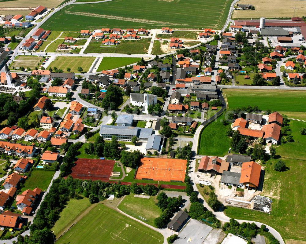 Aerial image Unterneukirchen - Village view on the edge of agricultural fields and land in Unterneukirchen in the state Bavaria, Germany