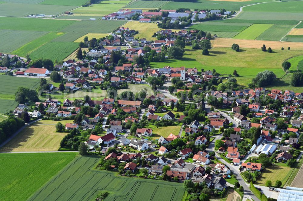 Unterschweinbach from the bird's eye view: Village view on the edge of agricultural fields and land on street Hauptstrasse in Unterschweinbach in the state Bavaria, Germany