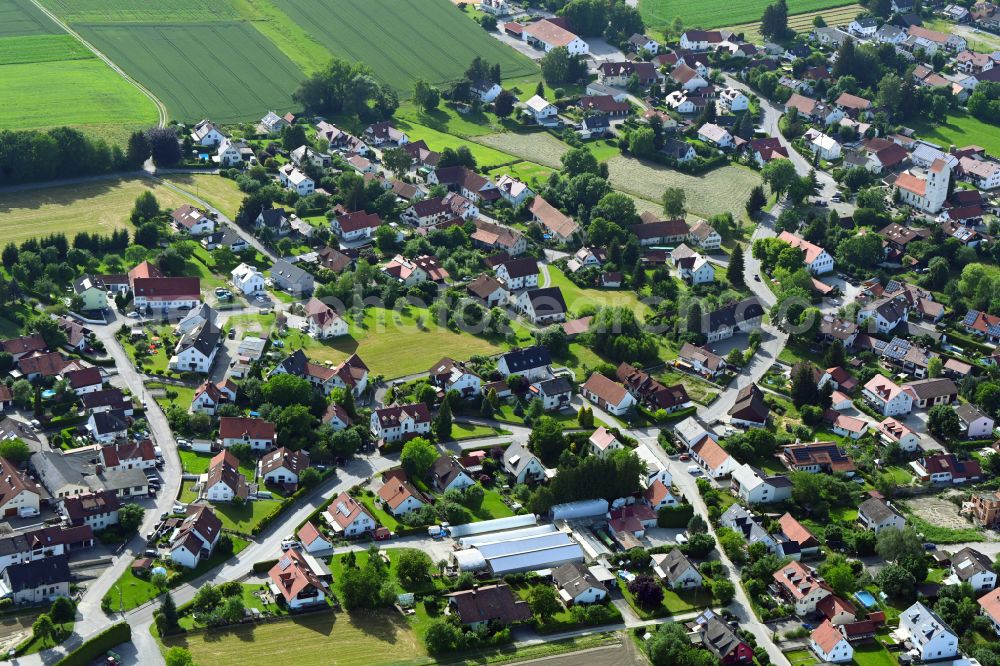 Unterschweinbach from above - Village view on the edge of agricultural fields and land on street Hauptstrasse in Unterschweinbach in the state Bavaria, Germany