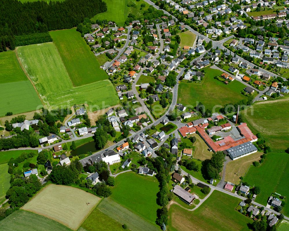 Unterweißenbach from above - Village view on the edge of agricultural fields and land in Unterweißenbach in the state Bavaria, Germany