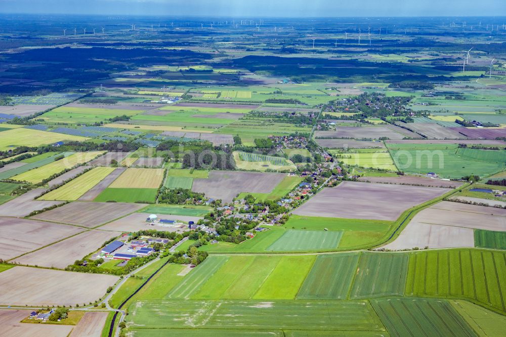 Uphusum from above - Village view on the edge of agricultural fields and land in Uphusum in the state Schleswig-Holstein, Germany